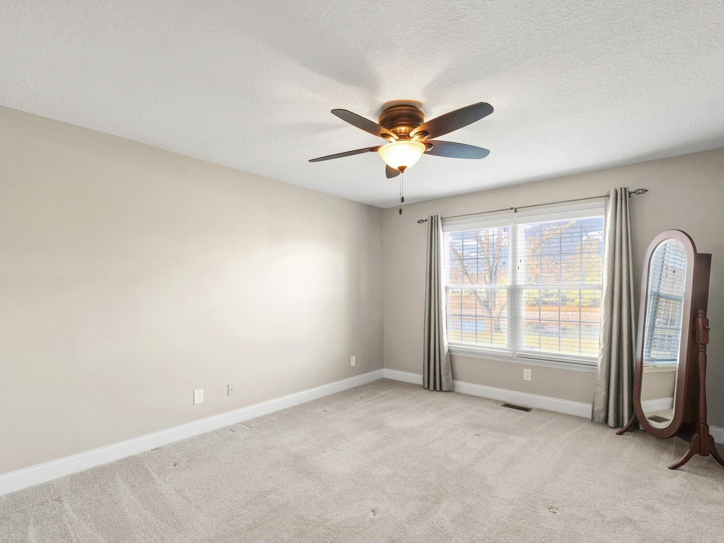 1901 Lakeside Drive, Unit B Champaign, IL 61821 - Photo 14 of 26 a view of an empty room with a window
