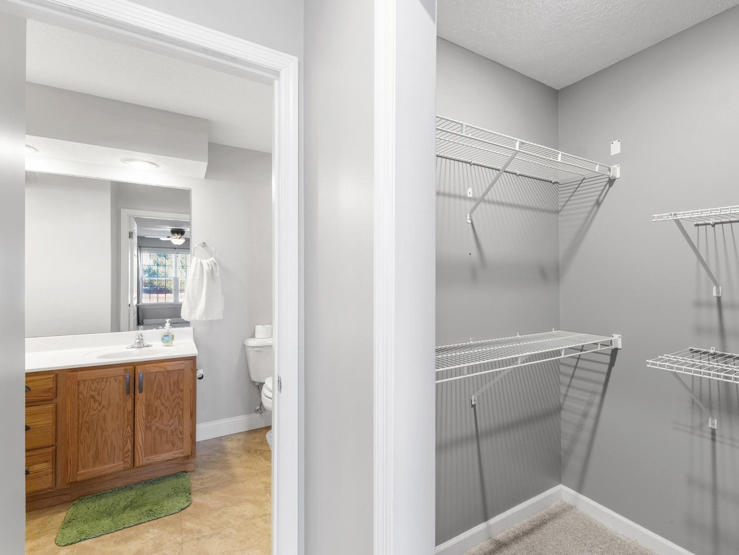 1901 Lakeside Drive, Unit B Champaign, IL 61821 - Photo 16 of 26 a bathroom with a sink a toilet and shower