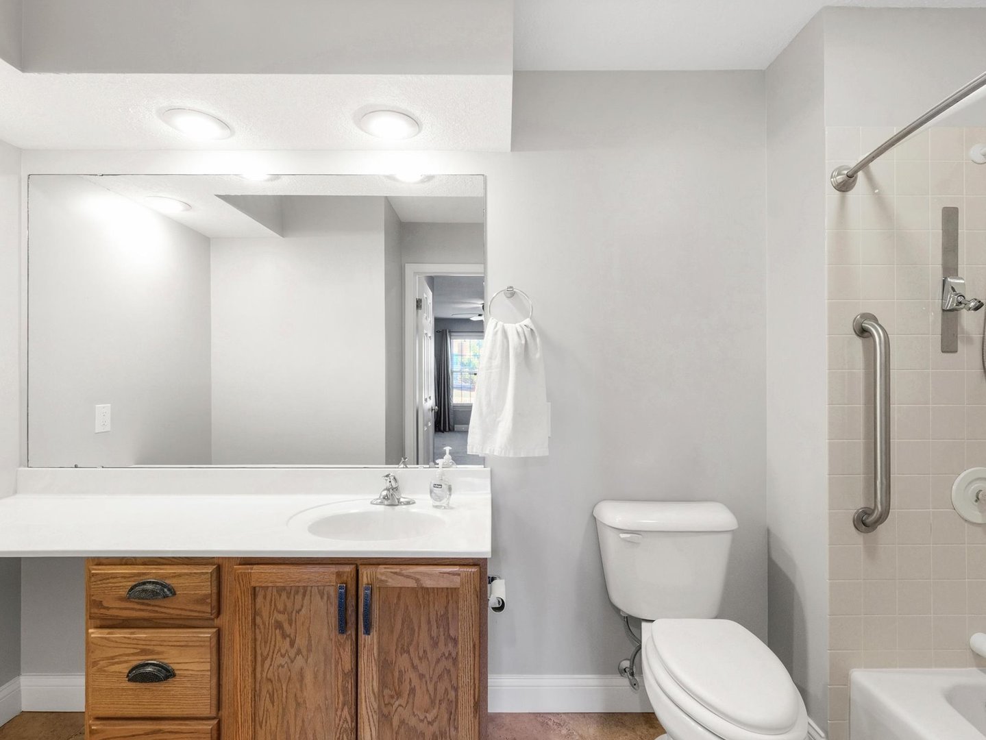 1901 Lakeside Drive, Unit B Champaign, IL 61821 - Photo 17 of 26 a bathroom with a sink a toilet and shower