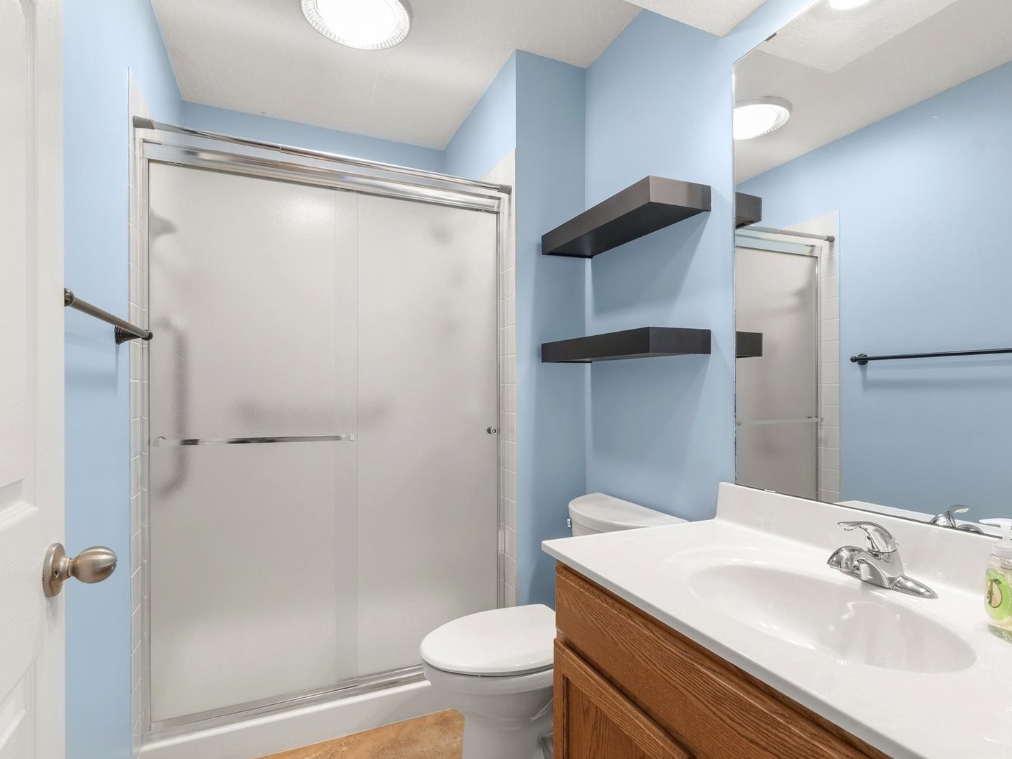 1901 Lakeside Drive, Unit B Champaign, IL 61821 - Photo 20 of 26 a bathroom with a granite countertop sink toilet and shower