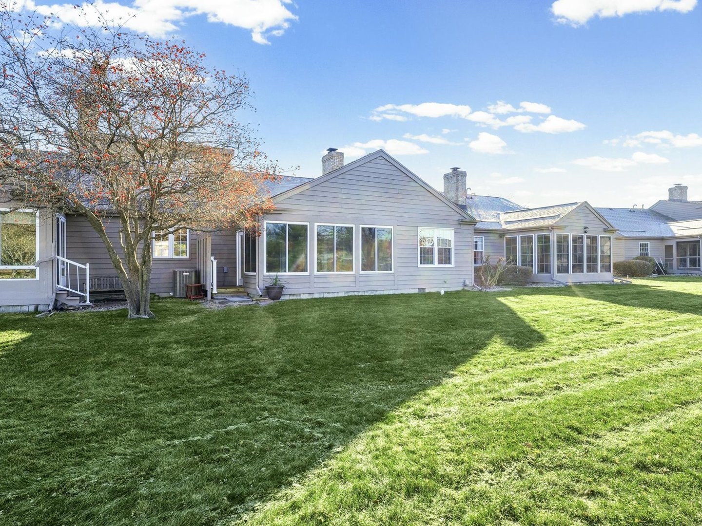 1901 Lakeside Drive, Unit B Champaign, IL 61821 - Photo 22 of 26 a front view of a house with a yard table and chairs