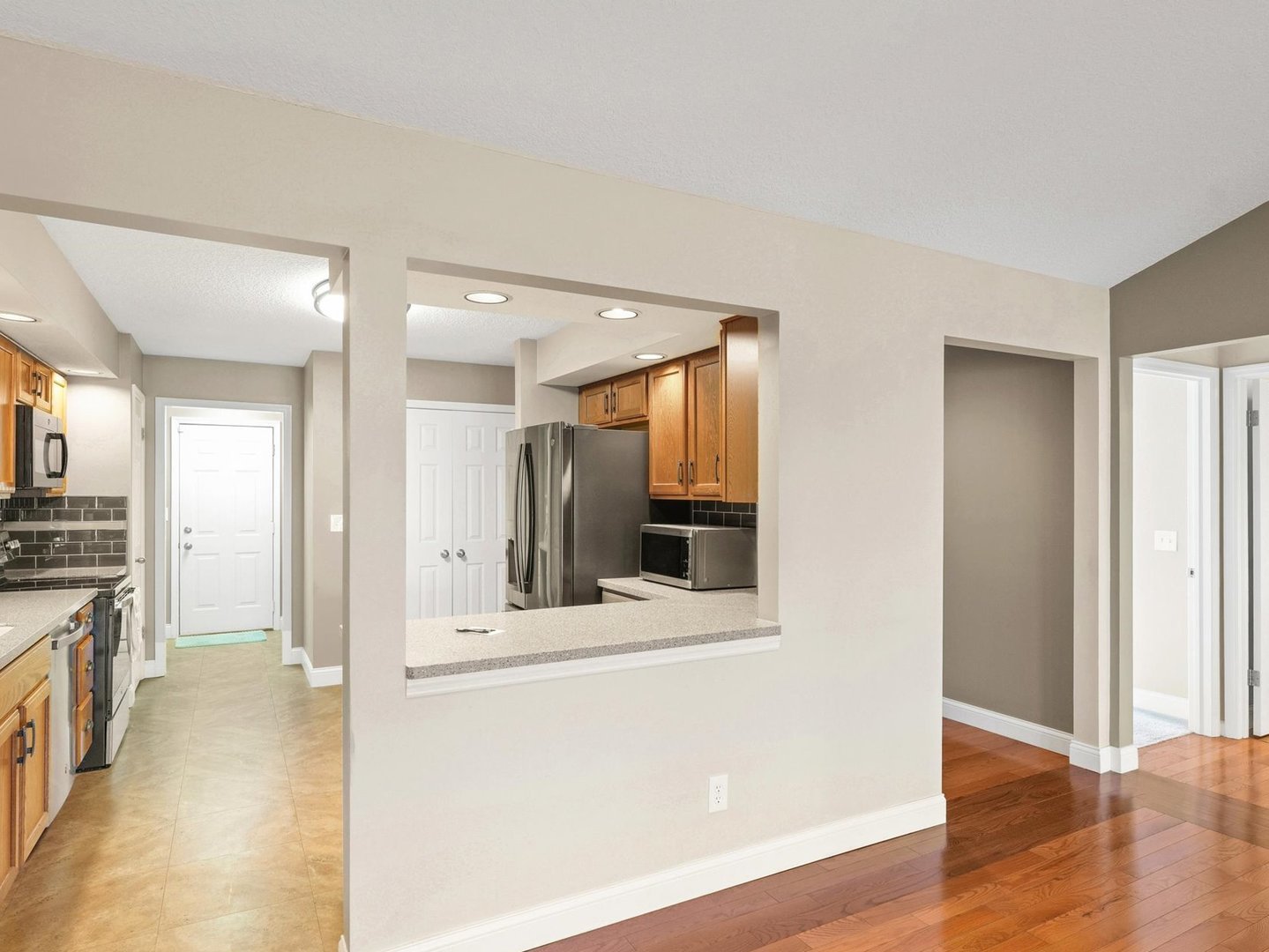 1901 Lakeside Drive, Unit B Champaign, IL 61821 - Photo 8 of 26 a view of a kitchen cabinets and a wooden floor