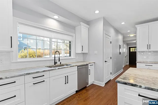 a kitchen with a sink and cabinets