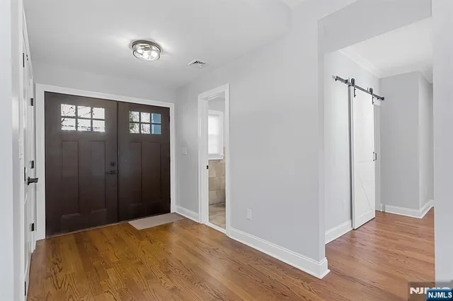 a view of empty room with closet and window