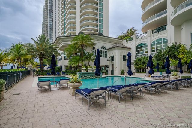 a view of a chairs and table in a patio