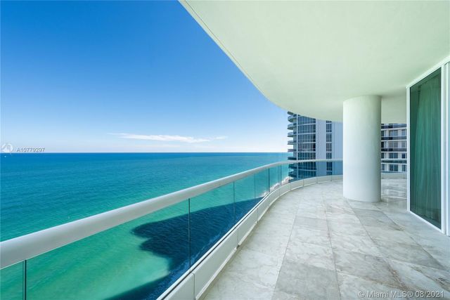 a view of an empty room with a fireplace