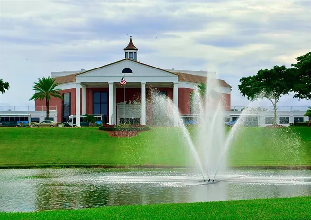 an aerial view of residential houses with outdoor space and river view
