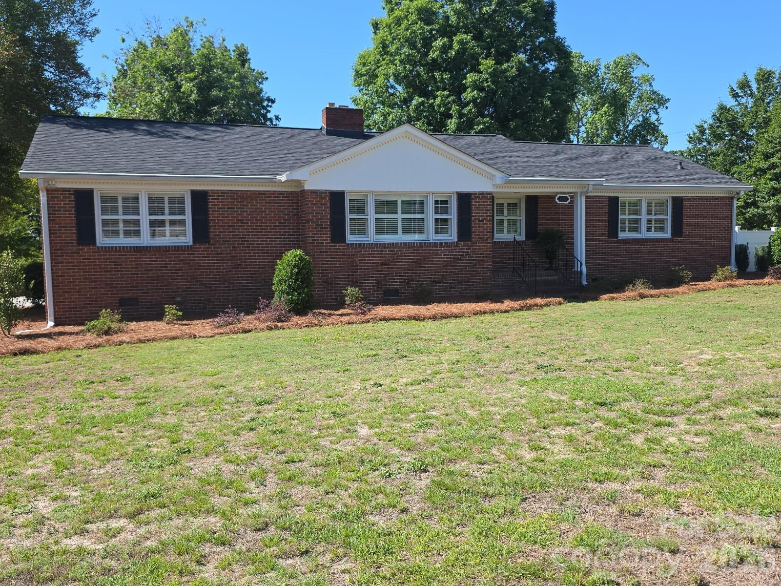 313 Pigg Street Pageland, SC 29728 - Photo 2 of 48 a house that has a big yard