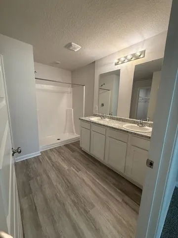 a view of a storage and utility room with a sink