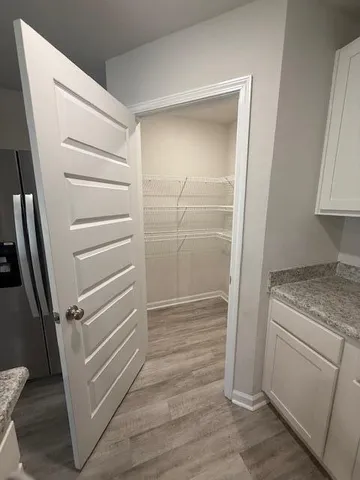 a bathroom with a shower and a sink