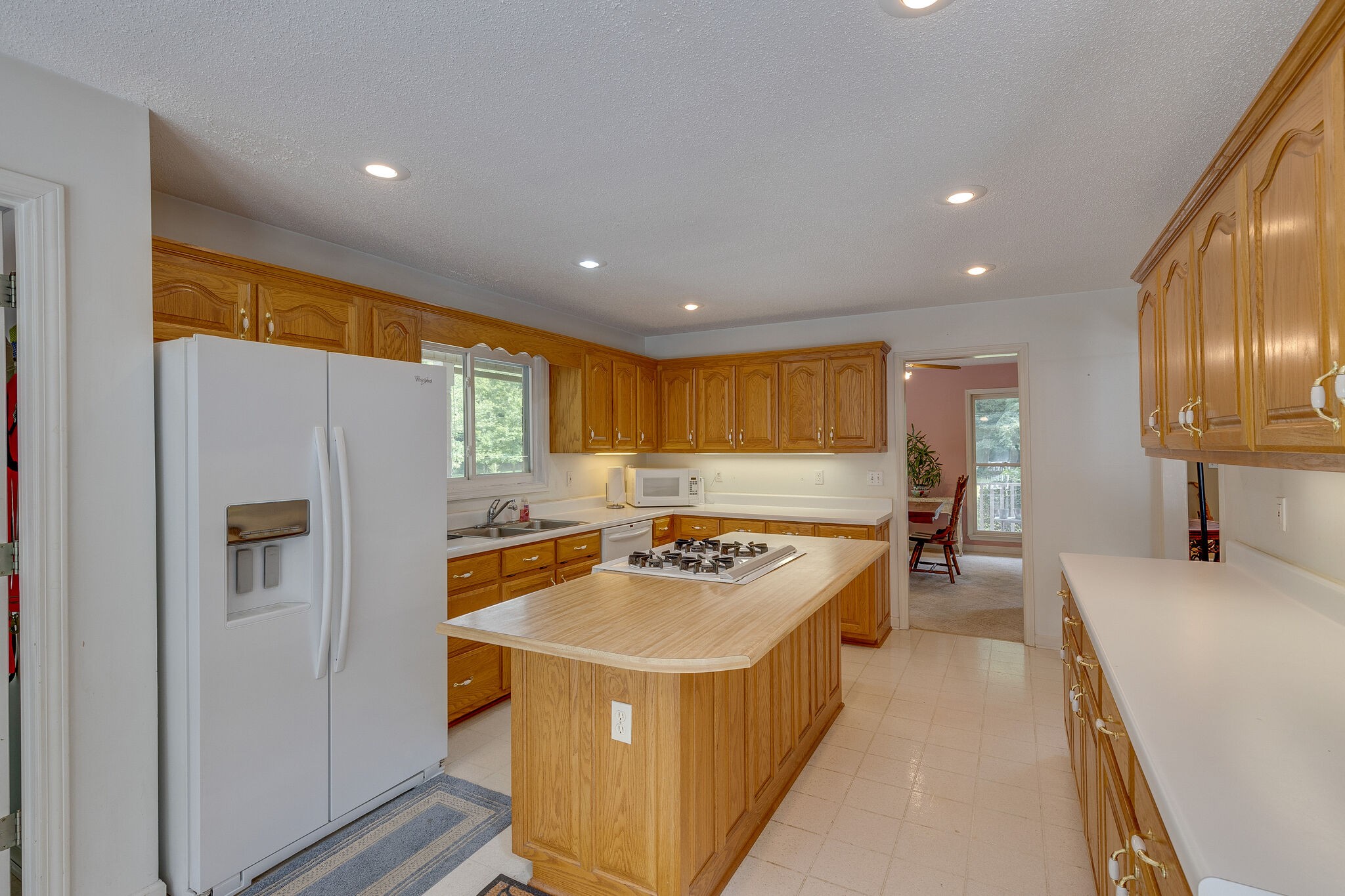 2300 Lee Road Spring Hill, TN 37174 - Photo 11 of 31 a kitchen with stainless steel appliances granite countertop a refrigerator a sink a stove and a refrigerator with wooden floor