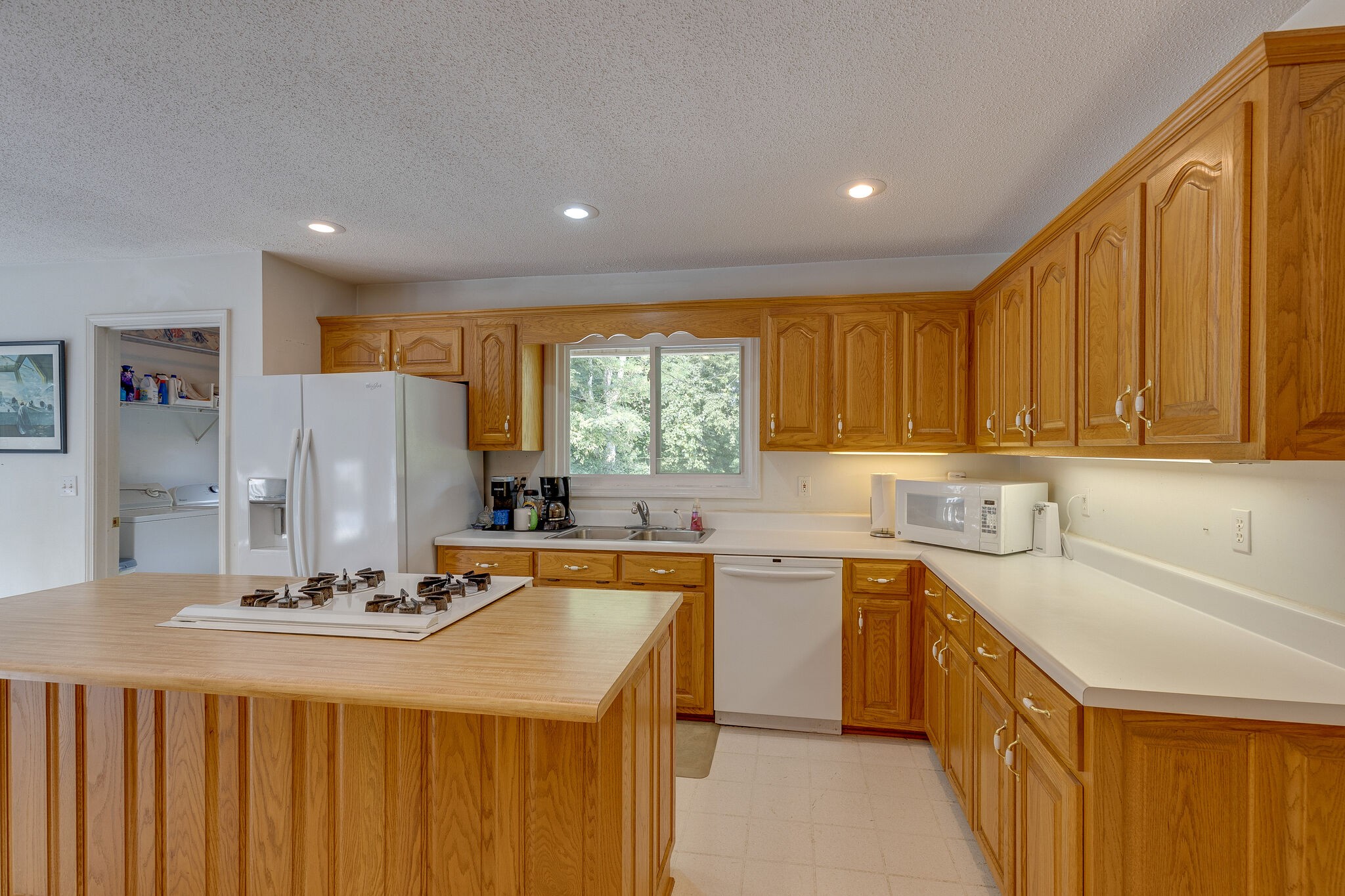 2300 Lee Road Spring Hill, TN 37174 - Photo 13 of 31 a kitchen with a sink a stove and cabinets