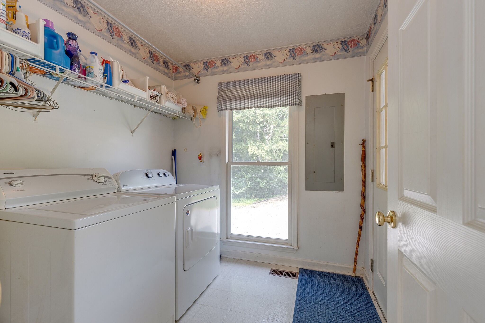 2300 Lee Road Spring Hill, TN 37174 - Photo 14 of 31 a view of storage and utility room with a washer and dryer