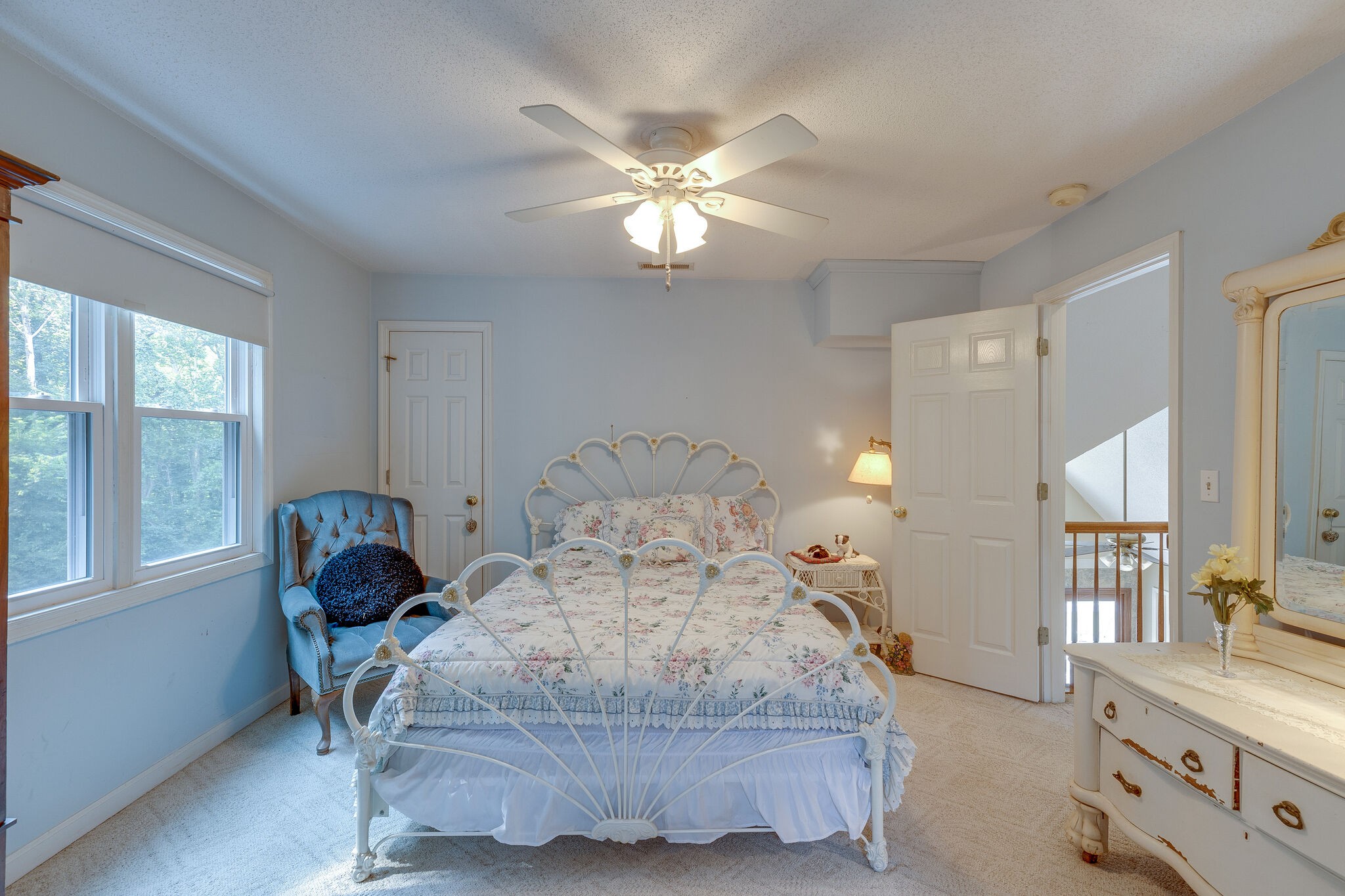 2300 Lee Road Spring Hill, TN 37174 - Photo 19 of 31 a bedroom with a bed and a chandelier