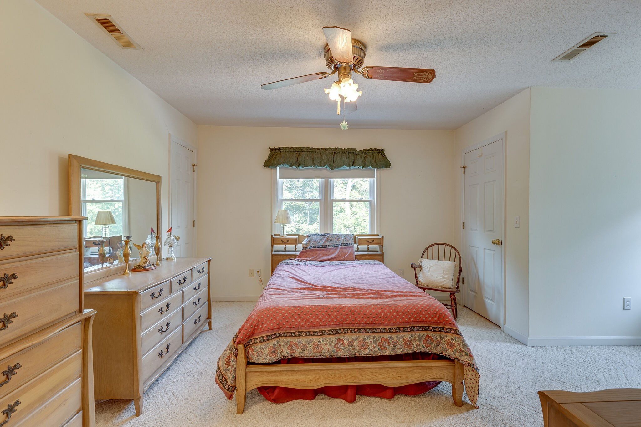 2300 Lee Road Spring Hill, TN 37174 - Photo 20 of 31 a spacious bedroom with a bed and a chandelier