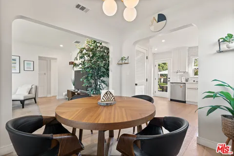 a kitchen with a table and chairs