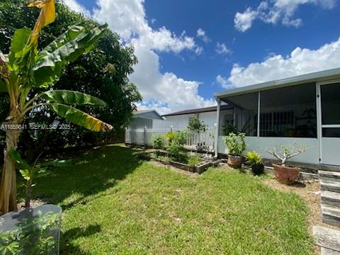 25931 Southwest 130th Avenue Homestead, FL 33032 - Photo 12 of 44 a view of house with backyard porch and sitting area