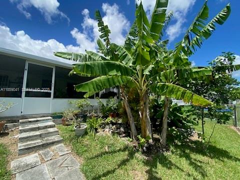 25931 Southwest 130th Avenue Homestead, FL 33032 - Photo 13 of 44 a view of a garden with plants