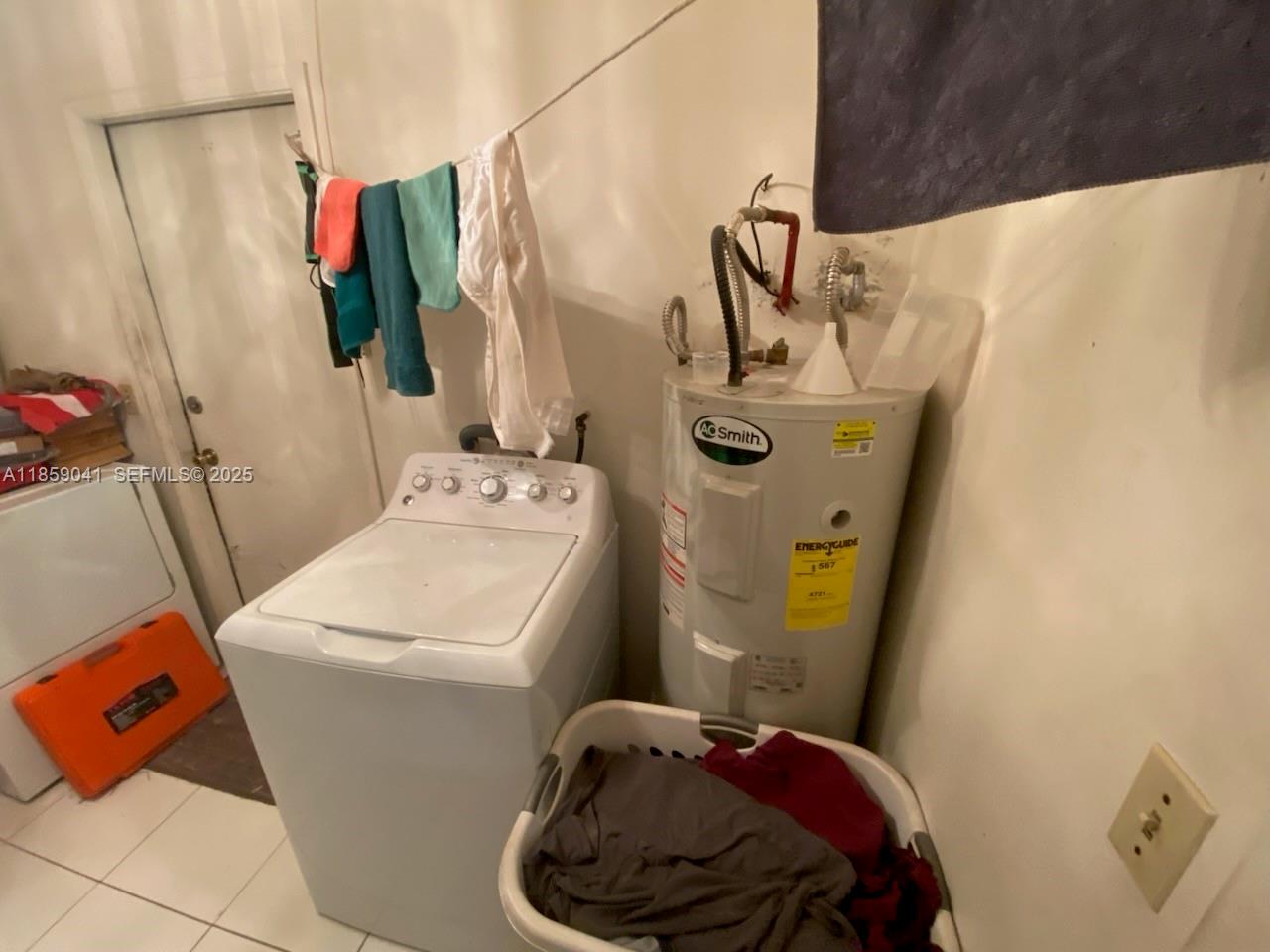 25931 Southwest 130th Avenue Homestead, FL 33032 - Photo 22 of 44 a bathroom with a sink and washing machine