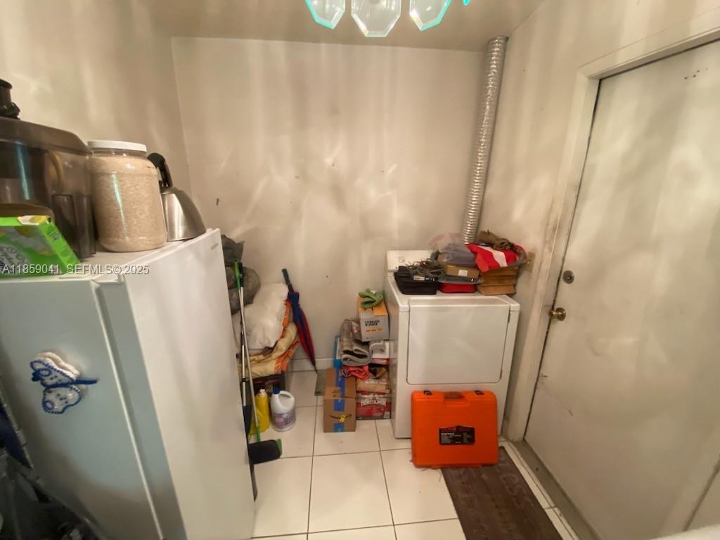 25931 Southwest 130th Avenue Homestead, FL 33032 - Photo 23 of 44 a utility room with dryer and washer