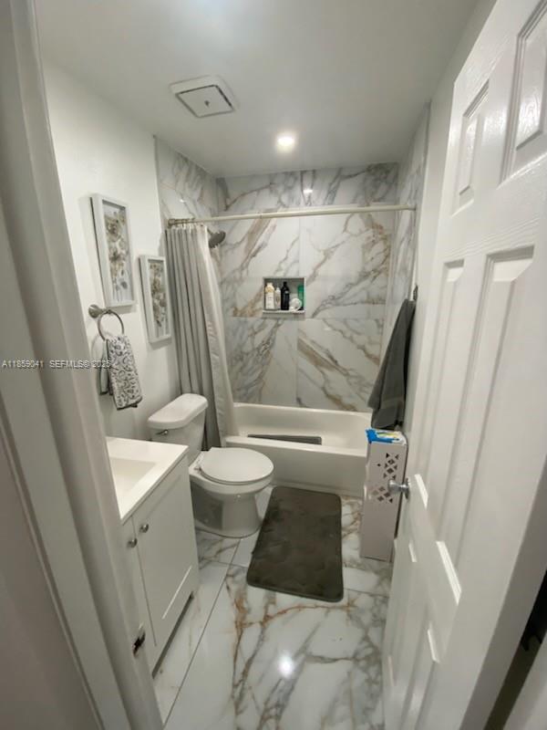 25931 Southwest 130th Avenue Homestead, FL 33032 - Photo 36 of 44 a bathroom with a toilet and a shower