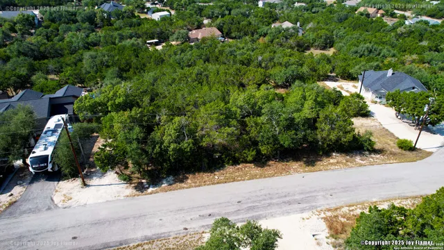 an aerial view of house with yard