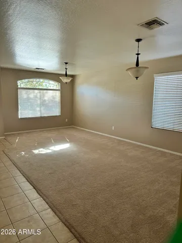 a view of empty room with windows