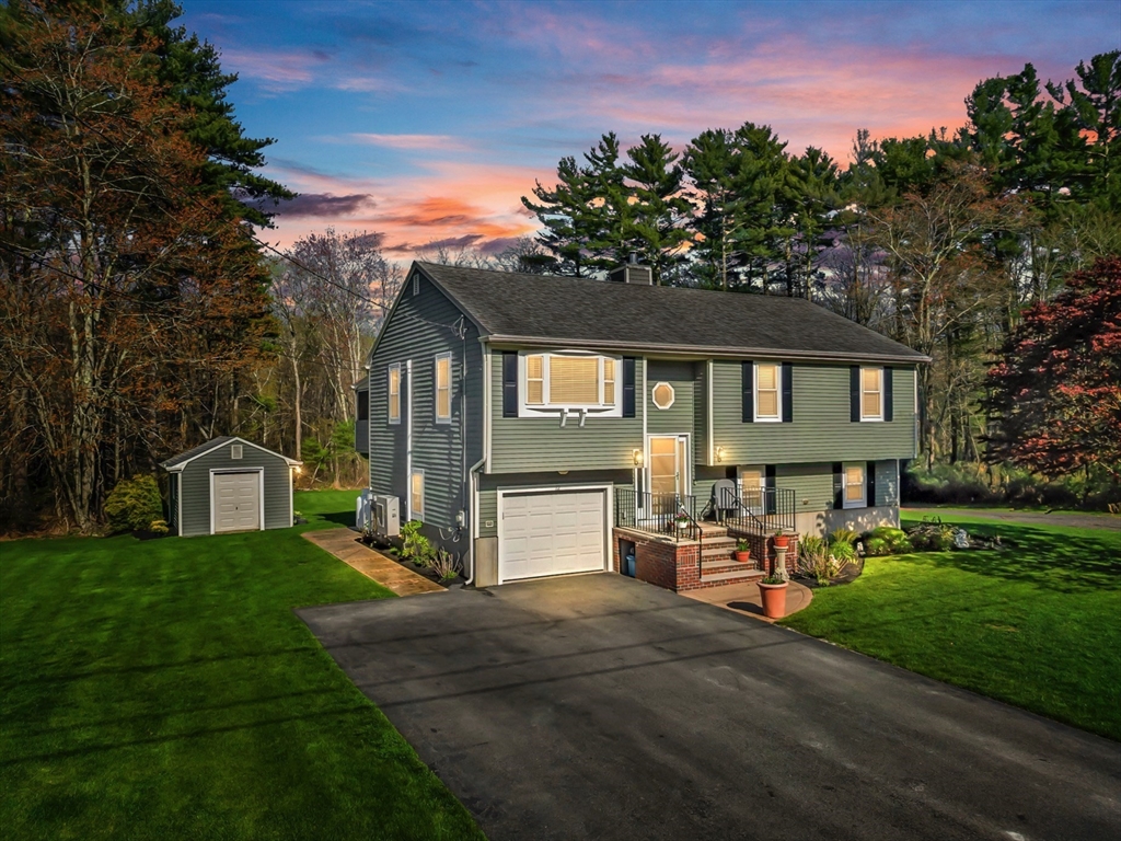 12 Elderberry Drive Acushnet, MA 02743 - Photo 1 of 41 a front view of a house with a yard table and chairs
