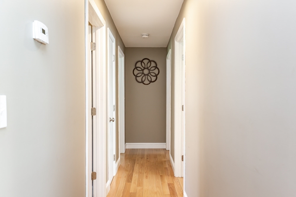 12 Elderberry Drive Acushnet, MA 02743 - Photo 11 of 41 a view of hallway with wooden floor