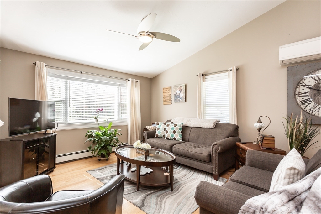 12 Elderberry Drive Acushnet, MA 02743 - Photo 12 of 41 a living room with furniture and a flat screen tv