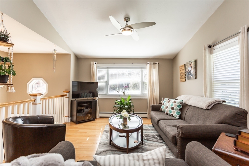 12 Elderberry Drive Acushnet, MA 02743 - Photo 13 of 41 a living room with furniture a window and a dining table