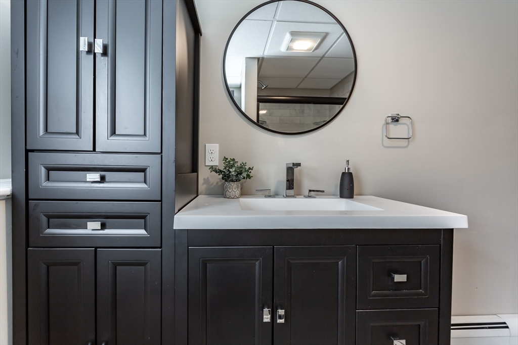 12 Elderberry Drive Acushnet, MA 02743 - Photo 26 of 41 a bathroom with a sink and a mirror