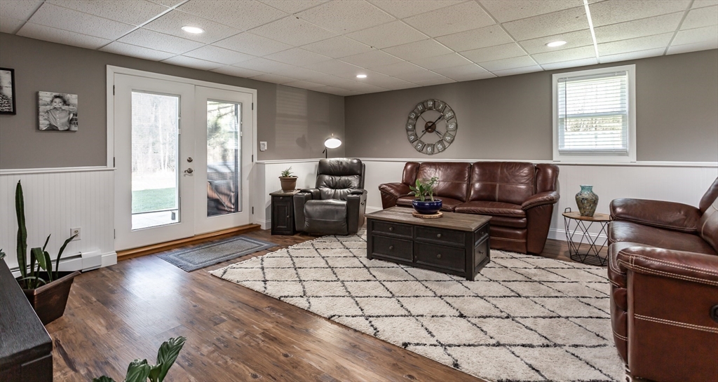 12 Elderberry Drive Acushnet, MA 02743 - Photo 28 of 41 a living room with furniture and wooden floor