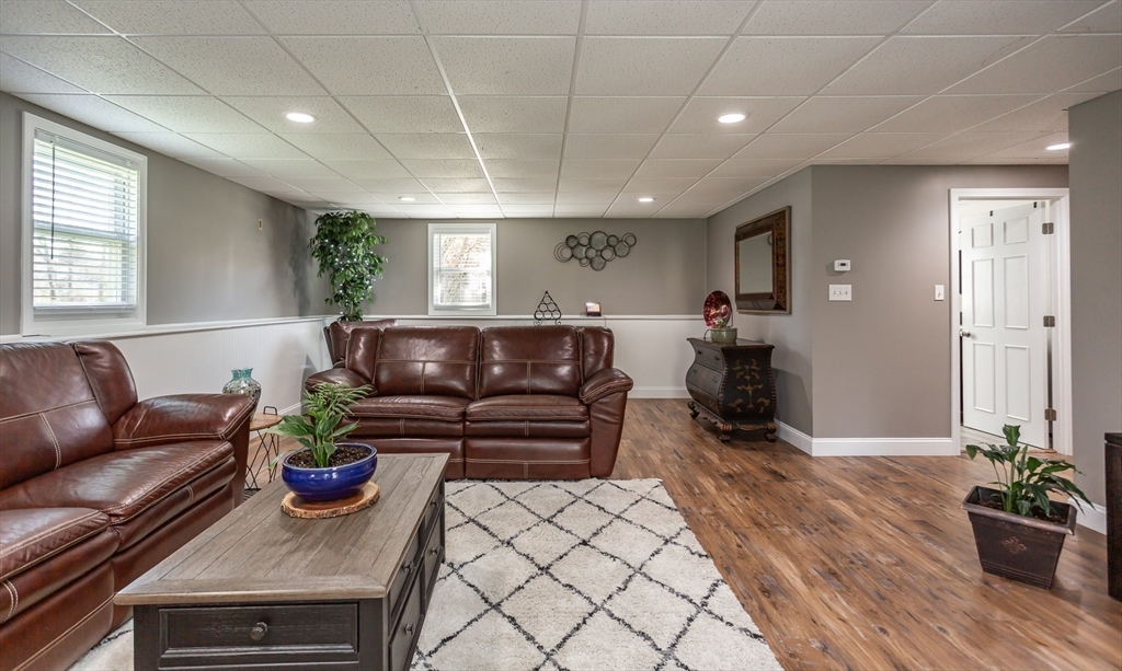 12 Elderberry Drive Acushnet, MA 02743 - Photo 30 of 41 a living room with furniture and wooden floor