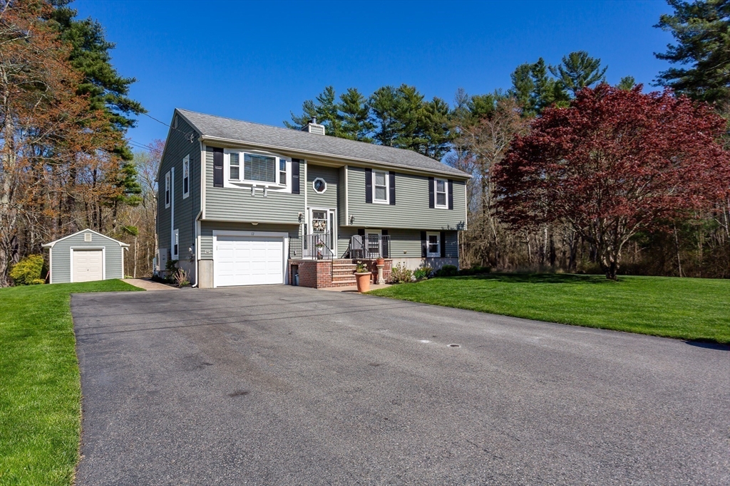 12 Elderberry Drive Acushnet, MA 02743 - Photo 3 of 41 a front view of a house with a yard and garage