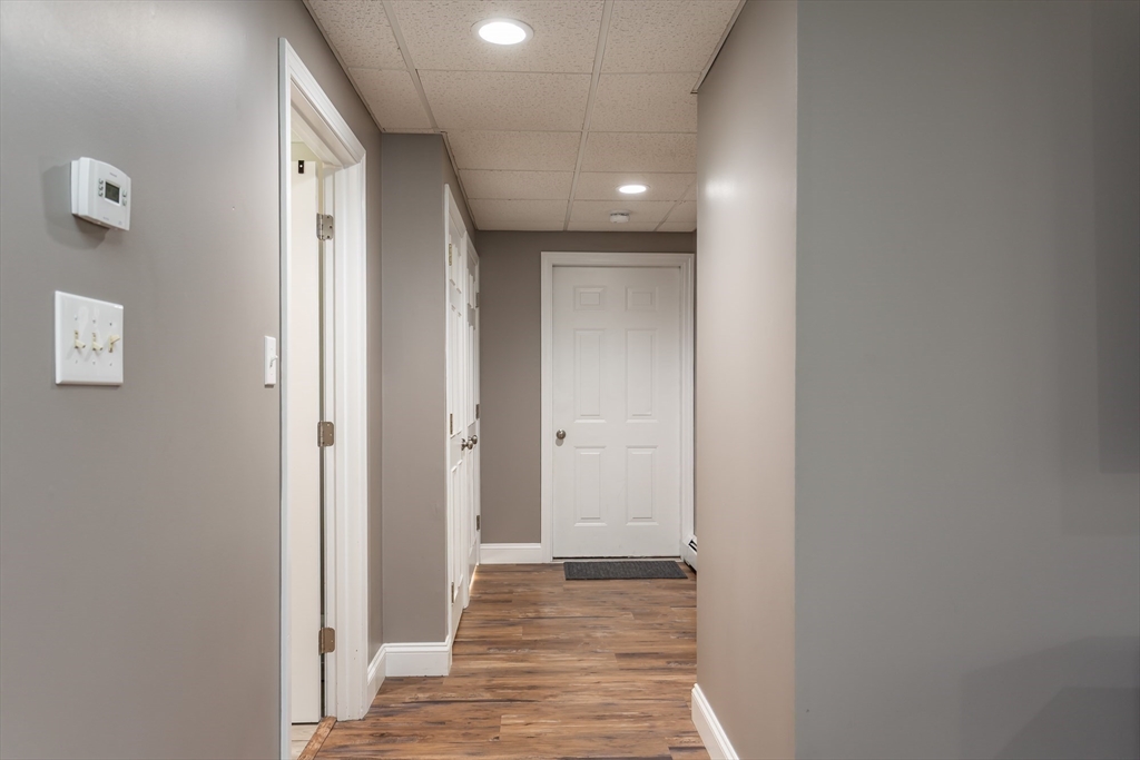 12 Elderberry Drive Acushnet, MA 02743 - Photo 32 of 41 a view of a hallway with wooden floor
