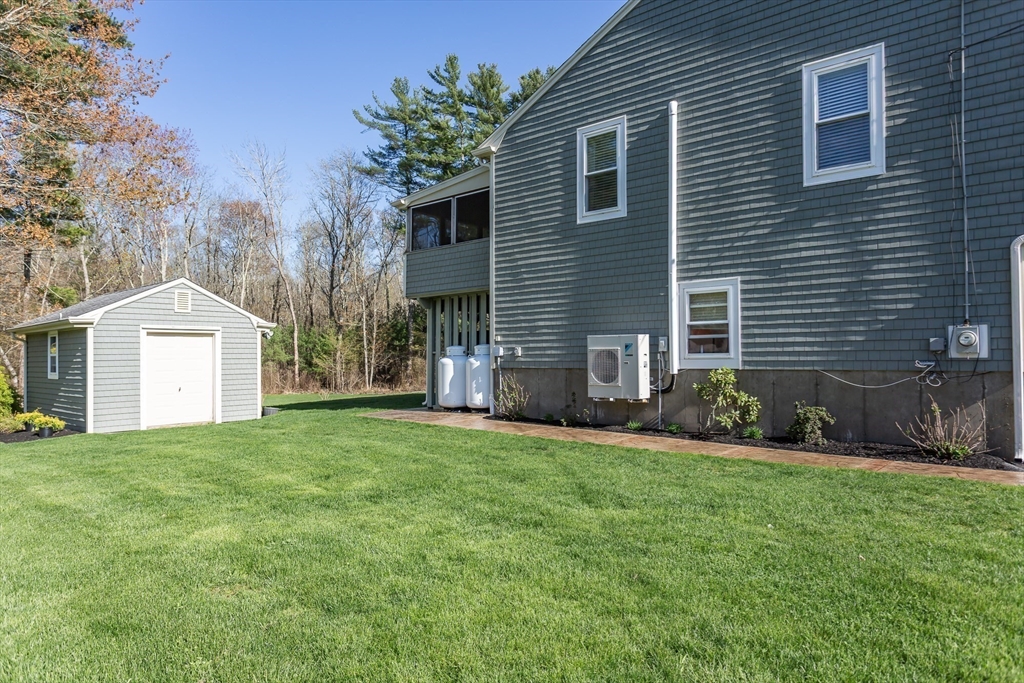 12 Elderberry Drive Acushnet, MA 02743 - Photo 35 of 41 a front view of a house with a yard and garage