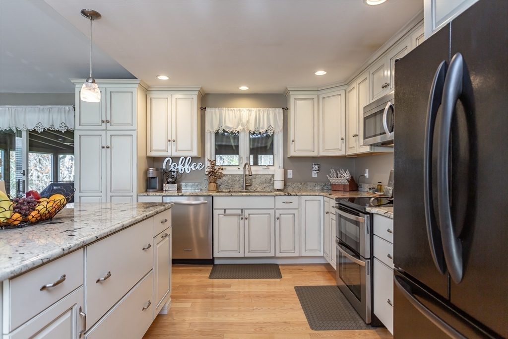 12 Elderberry Drive Acushnet, MA 02743 - Photo 5 of 41 a kitchen with stainless steel appliances granite countertop a refrigerator sink and stove