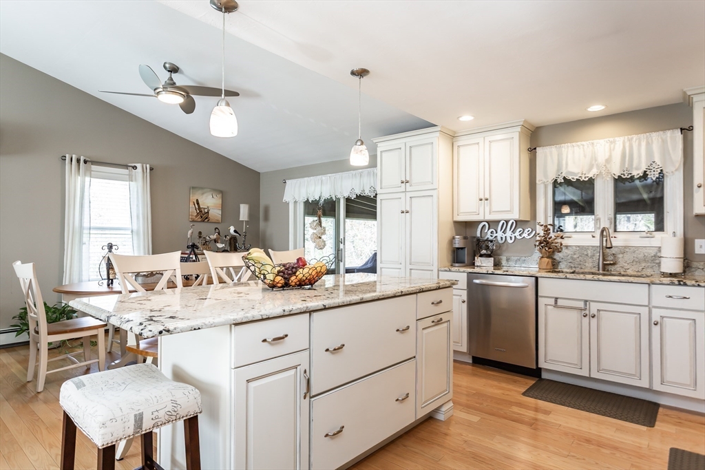 12 Elderberry Drive Acushnet, MA 02743 - Photo 6 of 41 a kitchen with kitchen island granite countertop a sink cabinets and stainless steel appliances