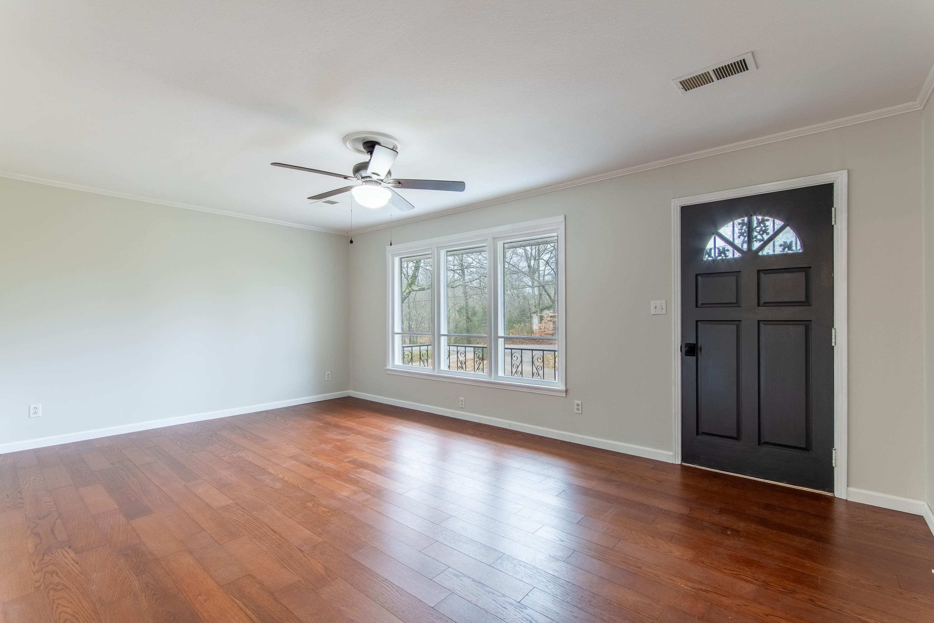 4155 Clifton Road Savannah, TN 38372 - Photo 4 of 40 Foyer entrance with crown molding, dark hardwood / wood-style floors, and ceiling fan