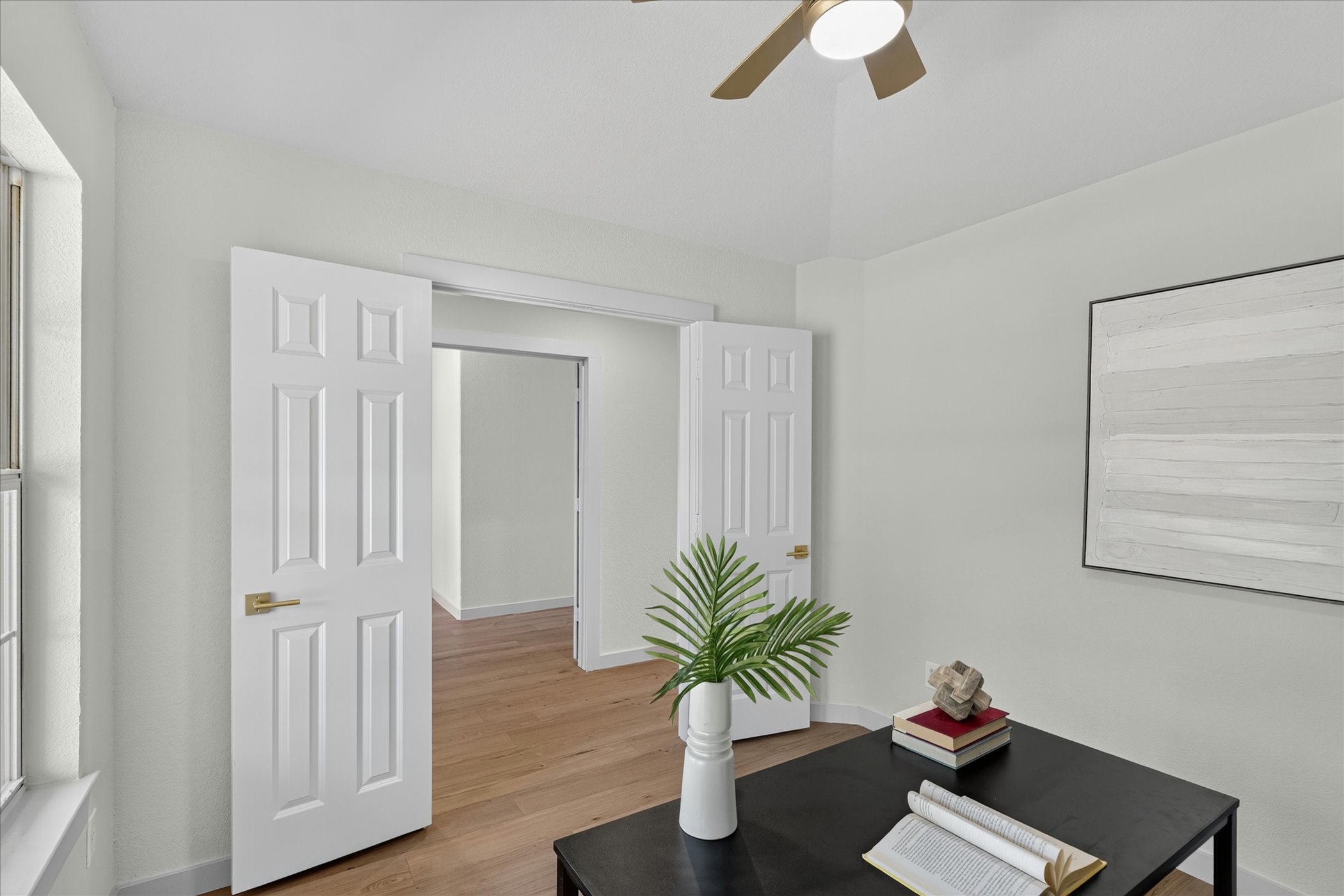 258 Pine View Loop Bastrop, TX 78602 - Photo 9 of 40 Hardwood floors and bright walls create an inviting, open-concept living space.