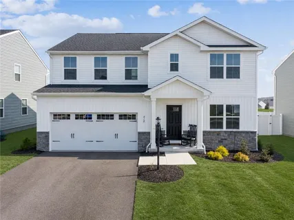 a view of house with yard and entertaining space