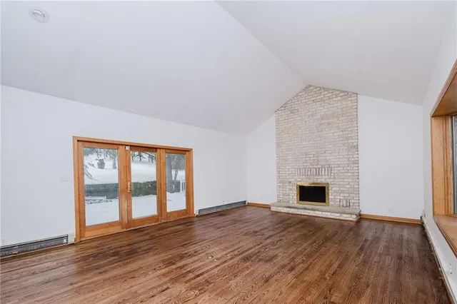 a view of a room with wooden walls