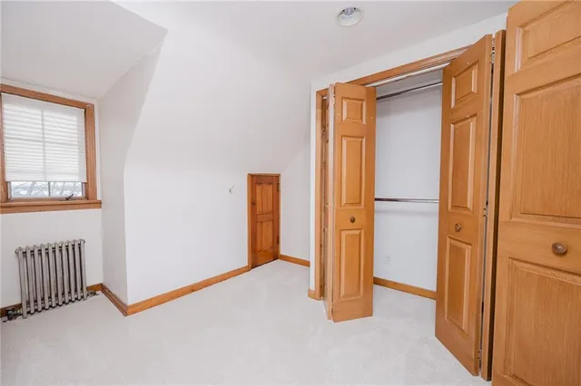 a bathroom with a toilet a sink and a mirror