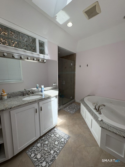 40 Looking Glass Hill Road Litchfield, CT 06750 - Photo 18 of 33 a bathroom with a granite countertop sink and a bathtub