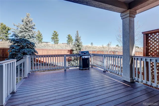 a view of a balcony with wooden floor