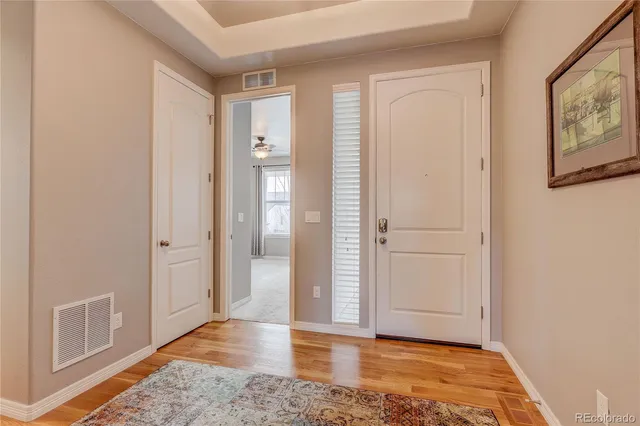 wooden floor in a hall with an entryway