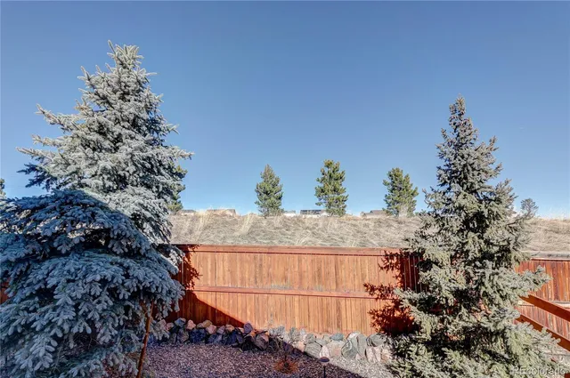 a balcony with a tree