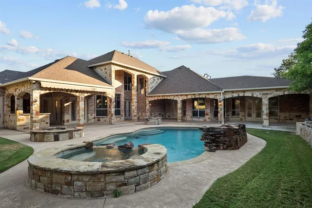 a front view of house with yard and patio