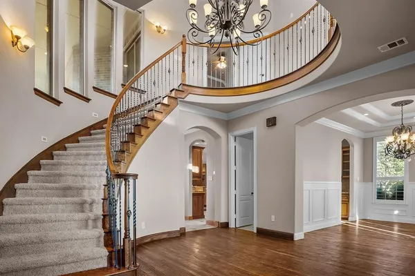 a view of entryway with wooden floor